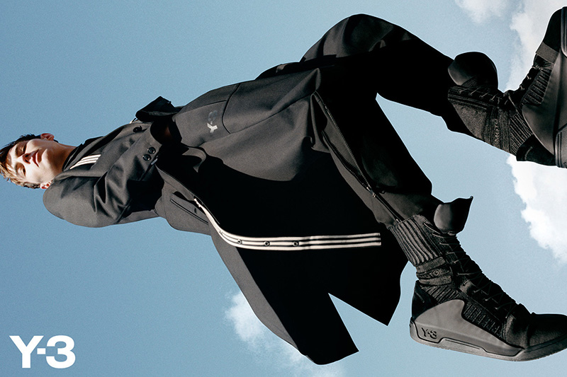 Y-3 takes to soaring heights for its fall-winter 2015 campaign. Model Max Esken is front and center for the advertisement, which was styled by Jodie Barnes with photography by Harley Weir.