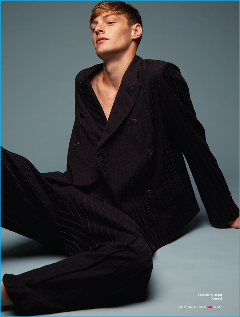 Roberto Sipos dons a double-breasted pinstripe suit from Giorgio Armani for GQ Brasil.
