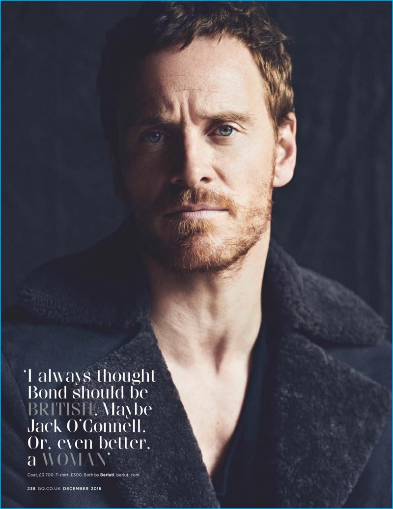 Appearing in a photo shoot for British GQ, Michael Fassbender wears a t-shirt and coat from Berluti.