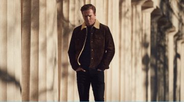 Damian Lewis wears a Tom Ford shearling-trimmed suede jacket with a Tod's sweater and Acne Studios jeans.