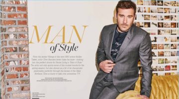 Clive Standen wears a grey Paul Smith suit with a Sandro t-shirt for Haute Living.