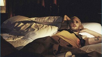 Relaxing in bed, Hopper Penn wears a Fendi look for GQ Italia.