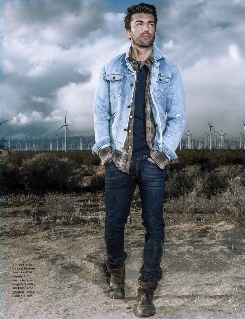 Embracing double denim, Justin Baldoni wears a vintage denim jacket by Lee. He also sports a 1791 Supply & Co. button-down, Roy Roger's jeans, and Jacob Holston henley. Baldoni rocks his own boots.