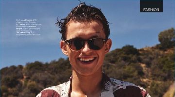 All smiles, Tom Holland wears an AllSaints shirt with Theory trousers and Garrett Leight sunglasses.