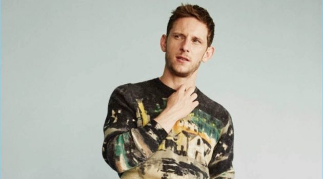 Actor Jamie Bell dons a Prada sweater with Dries Van Noten trousers.