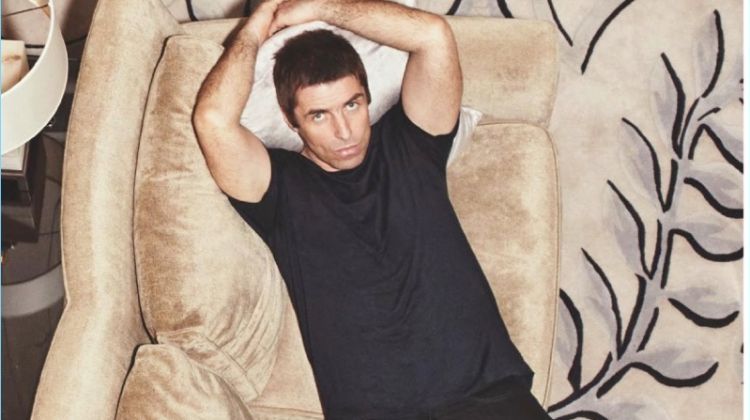 Relaxing, Liam Gallagher wears a Sunspel t-shirt with Levi's jeans.