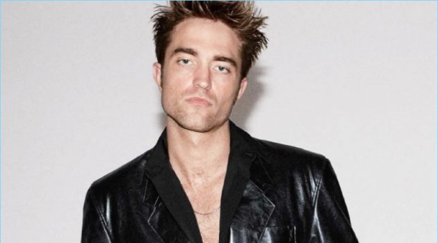 Rocking a Balenciaga leather jacket, Robert Pattinson also wears a shirt and jeans by Dior Homme.