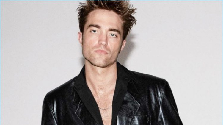 Rocking a Balenciaga leather jacket, Robert Pattinson also wears a shirt and jeans by Dior Homme.
