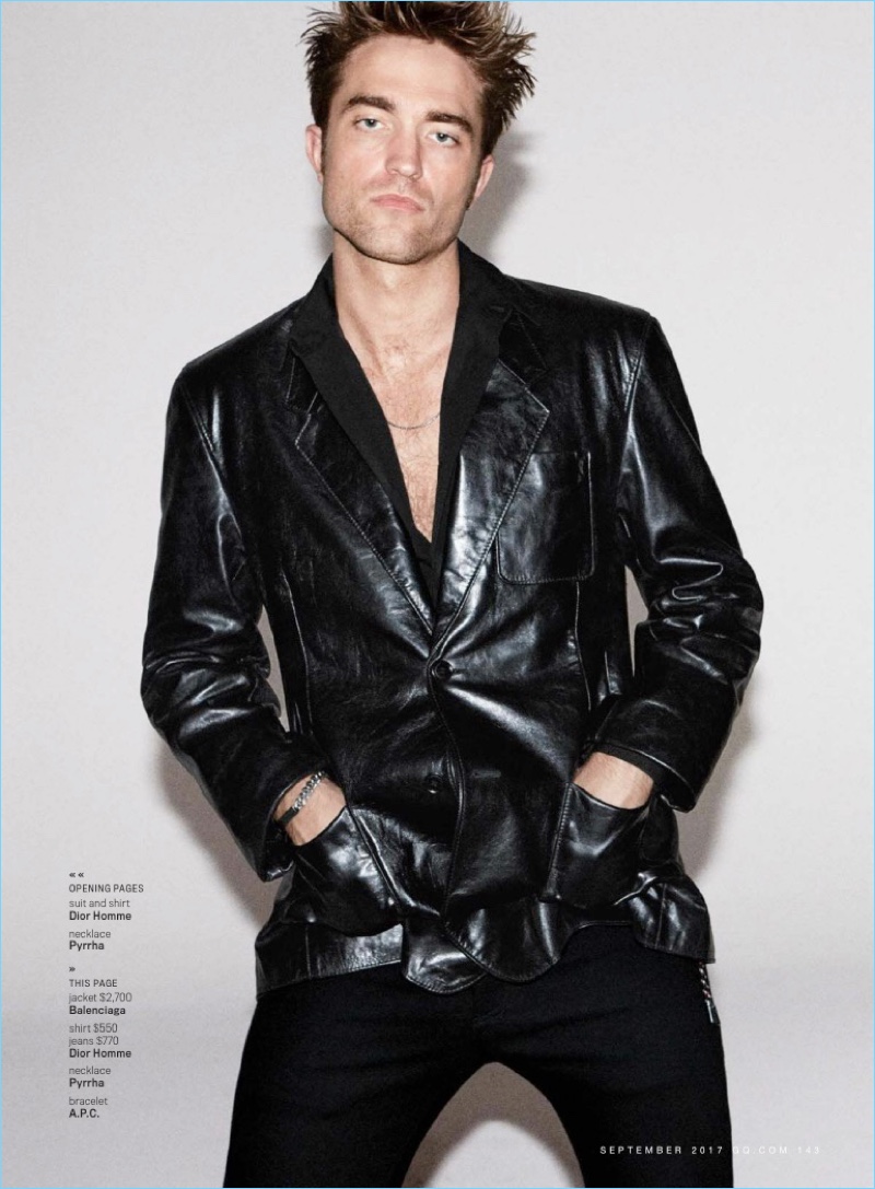 Rocking a Balenciaga leather jacket, Robert Pattinson also wears a shirt and jeans by Dior Homme.