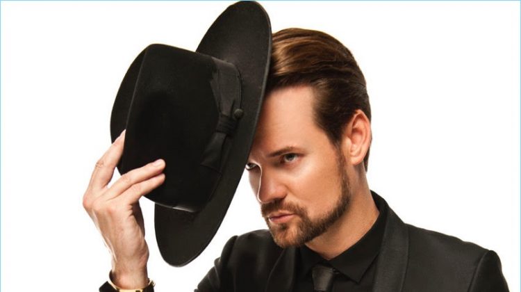 Dressed in black, Shane West wears a Noose & Monkey suit with an Emporio Armani shirt and Gladys Tamez Millinery hat.