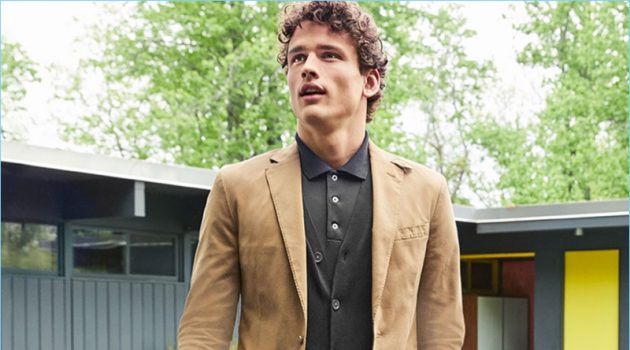 Macy's makes a case for smart fall layers. Simon Nessman wears a POLO Ralph Lauren sport coat $295 and v-neck cardigan $98.50. He also sports a POLO polo $98.50 and chino pants $89.50.