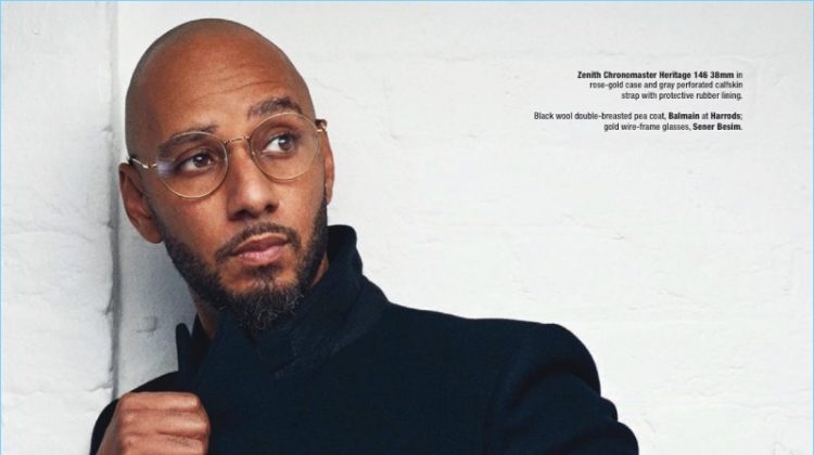 A sharp vision, Swizz Beatz wears a Balmain peacoat with Sener Besim sunglasses and a Zenith watch.