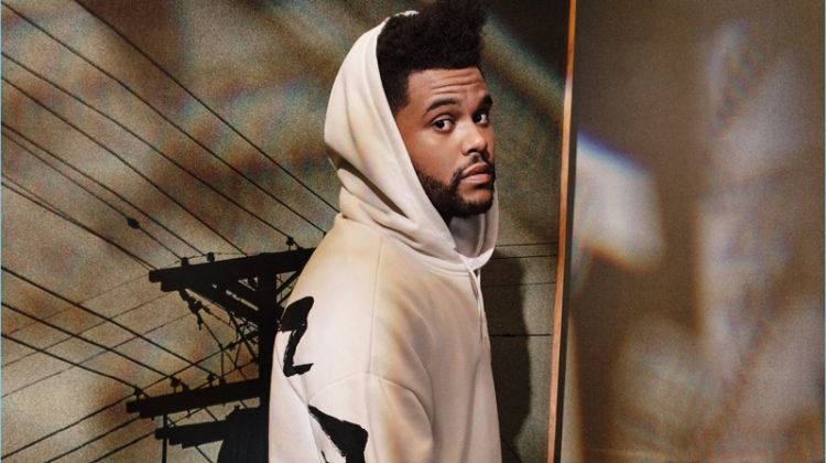 Reuniting with H&M, The Weeknd wears a white oversize hoodie $34.99.