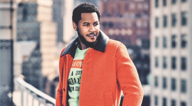 Connecting with Gotham, Carmelo Anthony wears a Valentino sweater and coat. He also dons Gucci trousers.