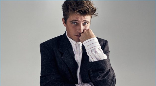 Actor Garrett Hedlund wears a Balenciaga tweed blazer and oversize button-down shirt.