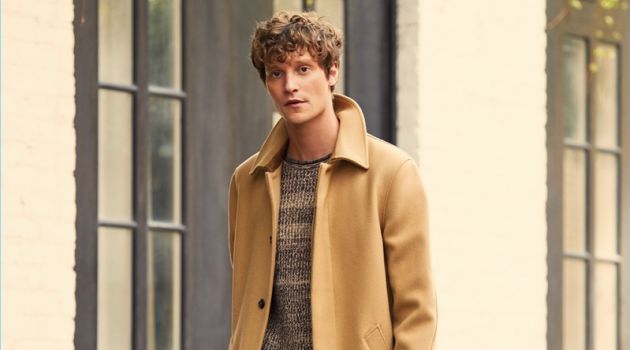 A.P.C. makes a classic camel statement with its Mac overcoat. East Dane complements the essential with a Tomorrowland sweater and trousers. Complete the look with a Cambridge Satchel folio.