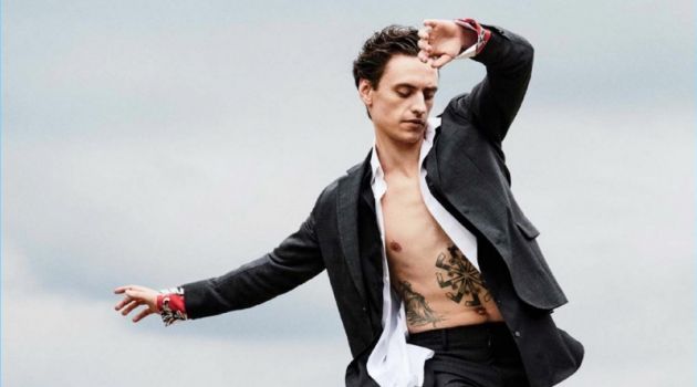 Striking a pose, Sergei Polunin dons a Salvatore Ferragamo suit with a J.W. Anderson shirt. Polunin layers with a Charvet shirt and wears Dries Van Noten shoes.