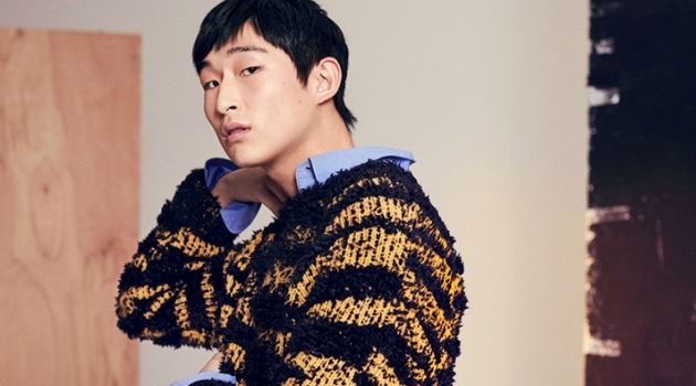 Making a texture play, Sang Woo Kim wears a Stella McCartney striped sweater and shirt.