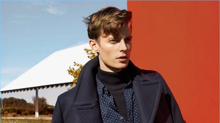 Club Monaco makes a case for navy and black style. Here, model Janis Ancens wears a peacoat with a turtleneck sweater. He also sports a polka dot print shirt and corduroy pants.