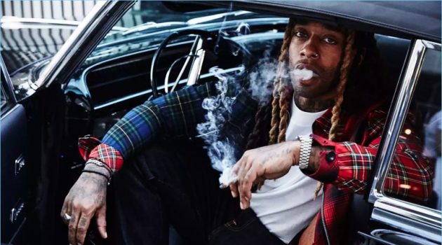 Getting behind the wheel, Ty Dolla $ign wears a Loewe jacket and NUDIE JEANS jeans.