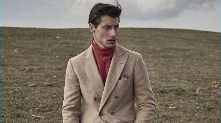 Jonas Mason dons a double-breasted coat for Brunello Cucinelli's fall-winter 2017 campaign.