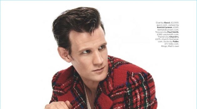 Starring in a British GQ photo shoot, Matt Smith wears a Gucci coat with a Kent & Curwen sweater. Smith also dons Paul Smith trousers and Church's sneakers.