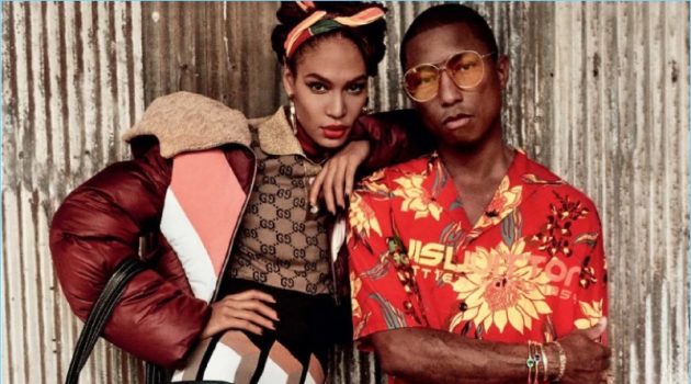 Embracing tropical style, Pharrell appears in a photo shoot with Joan Smalls. He wears a Louis Vuitton shirt with Cactus Plant Flea Market shorts, and Gentle Monster sunglasses. The artist also sports Adidas Originals sneakers and a Balenciaga bag.