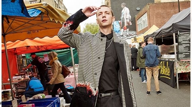 Yuri Pleskun wears a Haider Ackermann coat with a Les Hommes shirt. He also sports Jimmy Choo loafers, as well as a Dolce & Gabbana belt and trousers.