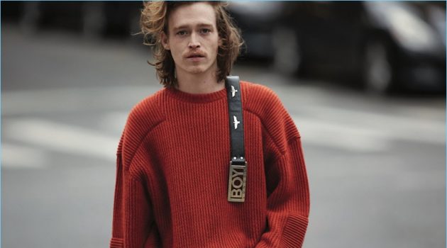 Actor Caleb Landry Jones wears a N. Hoolywood sweater with a vintage belt from What Goes Around Comes Around.