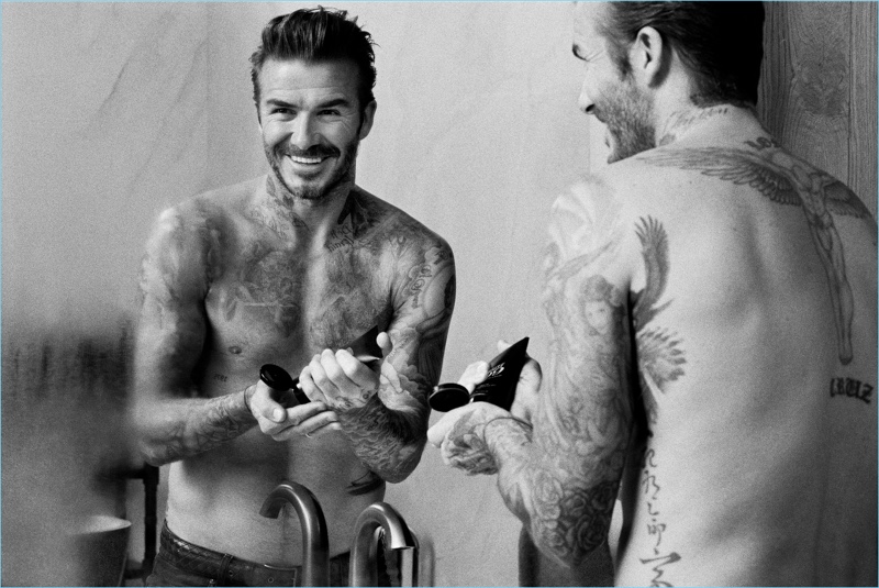 A shirtless David Beckham promotes his new grooming line, House 99.
