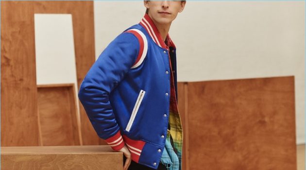 A varsity cool thrives with AMIRI's silk-satin bomber jacket, dip-dyed flannel shirt, t-shirt, and denim jeans.