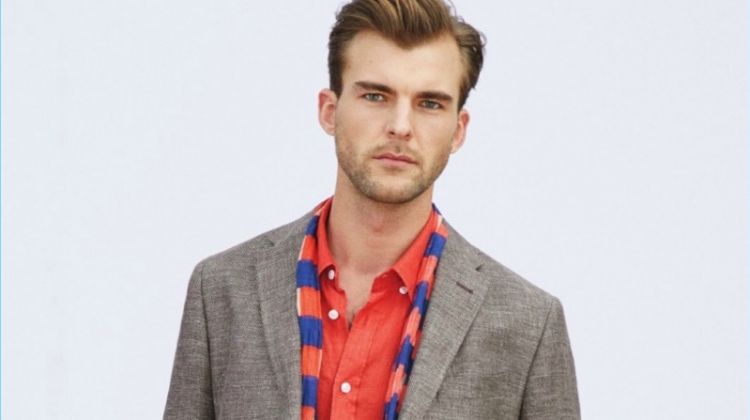Embracing Beymen Collection's latest styles, Patrick Kafka accessorizes with a scarf.