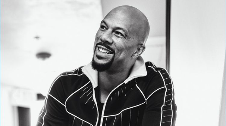 All smiles, Common wears a jacket and pants by Valentino with a top from Joe's Jeans.