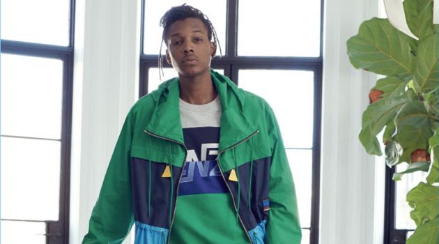 Going sporty, Matthew Davidson wears a parka, shorts, sweatshirt, and sneakers from Kenzo.