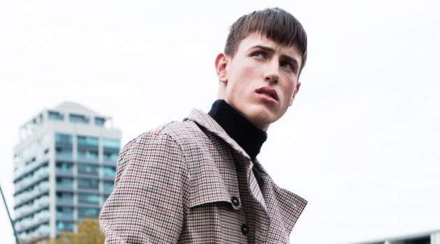 Deakin wears trench Topman and sweater Ksubi.