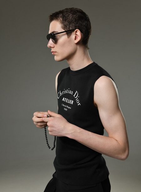 Misha wears sleeveless top Dior Homme.