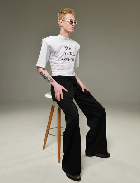 Dmitry wears sunglasses ASOS, t-shirt Vetements, and pants Dior Homme.