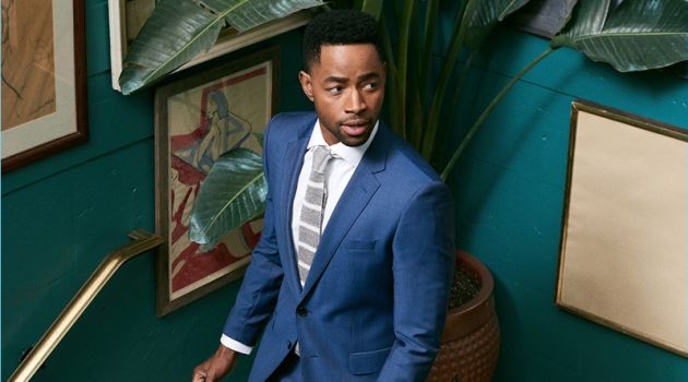 Jay Ellis dons a suit, shirt, and tie by BOSS.