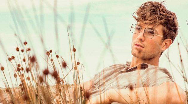 Relaxing, Saxon wears a Zara linen shirt and pants with TVR OPT glasses.