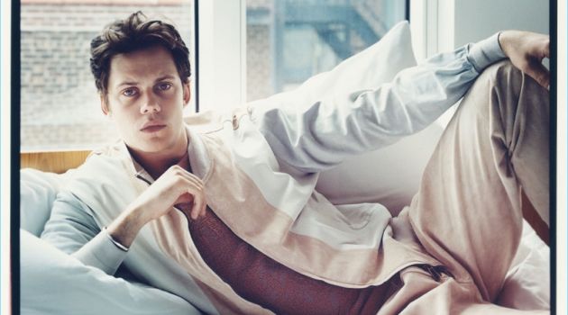 Relaxing in bed, Bill Skarsgård wears Ermenegildo Zegna Couture.