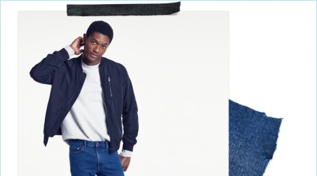 Slim Fit Jeans: Hamid Onifade sports H&M slim jeans with a pullover and bomber jacket.