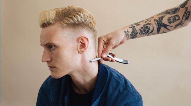 Model Alexander Johansson receives a hair update with a side part faded to skin hairstyle.