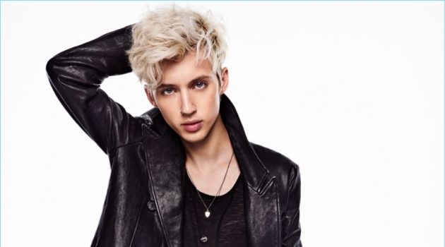 Clad in an Alexander McQueen leather coat, Troye Sivan also wears a Saint Laurent tank and Topman jeans.