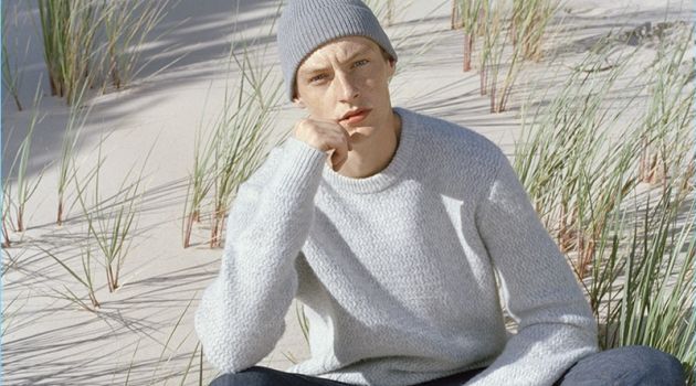 A smart vision, Roberto Sipos wears a sweater and slim-fit jeans.