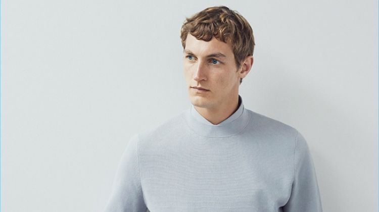 A smart vision, Rutger Schoone wears a COS mock-neck knitted sweater and cotton shirt.