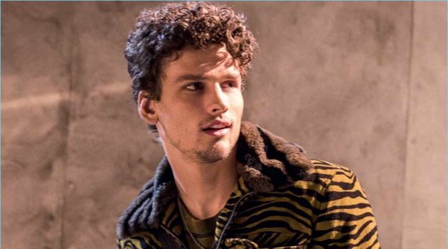 Simon Nessman sports a tiger print jacket from Bottega Veneta's fall-winter 2018 collection.