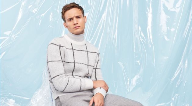 Embracing pale shades of grey, Julian Schneyder wears a look from River Island's Christmas collection.