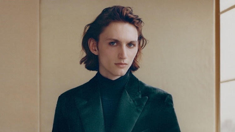 Henry Rausch dons a velvet tuxedo jacket and a wool-blend turtleneck sweater by Brioni.