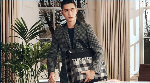 Keisuke Asano takes hold of Furla's Mercurio Tartan bag for its fall-winter 2018 campaign.