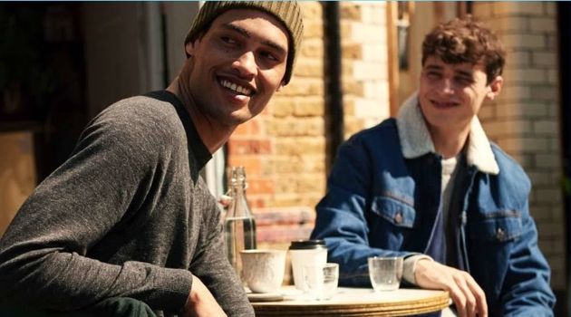 Left: All smiles, Cameron Gentry wears a H&M raglan-sleeved sweater and jeans. Right: Adrien Sahores wears a denim trucker jacket and joggers.